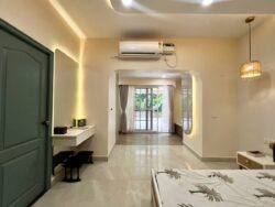 Effortless flow, minimalist elegance. A serene Japandi master bedroom with a custom walk-in wardrobe featuring a soft curved entrance.