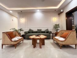 Where Japanese minimalism meets Scandinavian warmth Serene Japandi-style sitting area with a natural cane and wood sofa and neutral textiles.