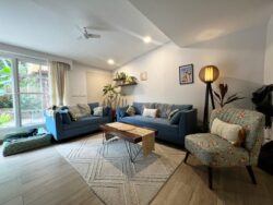 Curated for conversation and relaxation Close-up of the plush sofa and coffee table in a Japandi luxury living room